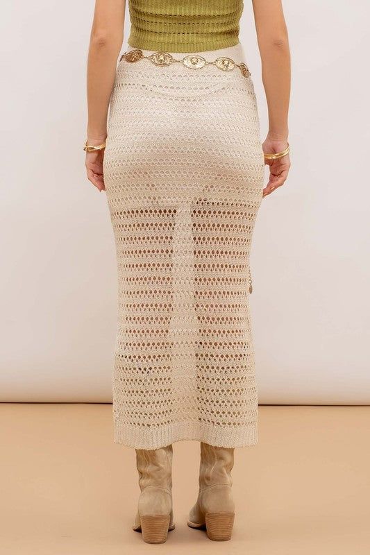 Expertly crafted with an elasticized waist for a comfortable and flexible fit, this Natural Crochet midi skirt features a straight cut and ribbed hem for a flattering silhouette. The knit design is lined for added coverage, making it a versatile and stylish choice for any occasion. Fabric & fit:SHELL: 93%ACRYLIC, 7%NYLONLINING: 100%POLYESTER Model is wearing size small. Spring Ribbed Beige Skirt, Spring Fitted Pointelle Knit Skirt, Fitted Pointelle Knit Skirt For Spring, Spring Knit Bottoms With Elastic Waistband, Fitted Knit Skirt With Lining, Fitted Knit Lined Skirt, Fitted Knit Midi Bottoms, Fitted Knit Midi-length Bottoms, Fitted Pointelle Knit Bottoms For Spring