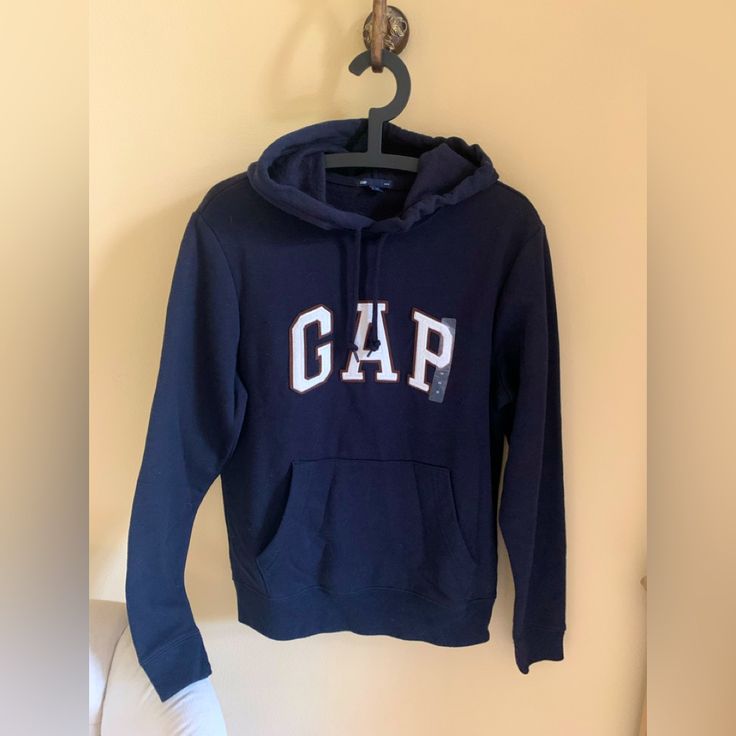 Xs Gap Hoodie. Long Sleeve Banded Cuffs, Fleeced Hoodie With Kanga Pocket. Banded Hem With Drawcord Ties At Hood. Embroidered Gap Logo At Front. Nwot Never Worn Gap Sweatshirt, Gap Hoodie, Navy Blue Hoodie, Camouflage Hoodie, Hoodie Logo, Gap Men, Vintage Hoodies, Hoodies Men Pullover, Pullover Men