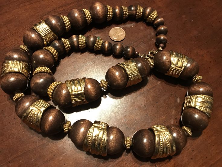 "Vintage Cadoro Wooden Bead and Gold Ring Necklace The necklace is signed \"CADORO\" and measures 30\". The necklace has been well-maintained and cared for over the years. It is in good vintage condition. -------------------------- CADORO - JEWELLERY TO THE RICH AND FAMOUS, Cadoro is very high quality jewellery and was founded by Actor Steve Brody and Dan Staneskieu in 1945. They traveled all over the world to source only the highest quality materials. It was originally very expensive, fashion f Expensive Fashion, Rich And Famous, High Quality Jewelry, Wooden Beads, Wood Beads, Ring Necklace, Costume Jewelry, Gold Ring, Gold Rings