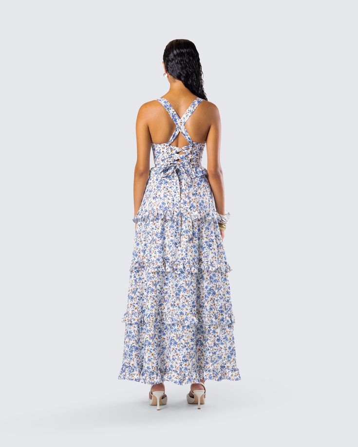 The dress that will have everyone begging to be your summer fling 🥰 Made from plain weave woven fabric and complete with a fit & flare style with tiered ruffles for the perfect flirty and floral look 💙 Summer Tiered Maxi Dress With Tie Back, Casual Tiered Ruffle Floral Dress, Spring Ruffle Dress With Smocked Back, Casual Tiered Floral Dress With Ruffles, Tiered Maxi Dress With Tie Back For Brunch, Floral Print Ruffle Sundress For Spring, Spring Floral Print Sundress With Ruffles, Feminine Ruffled Sundress For Vacation, Spring Vacation Ruffle Dress With Ruffled Straps