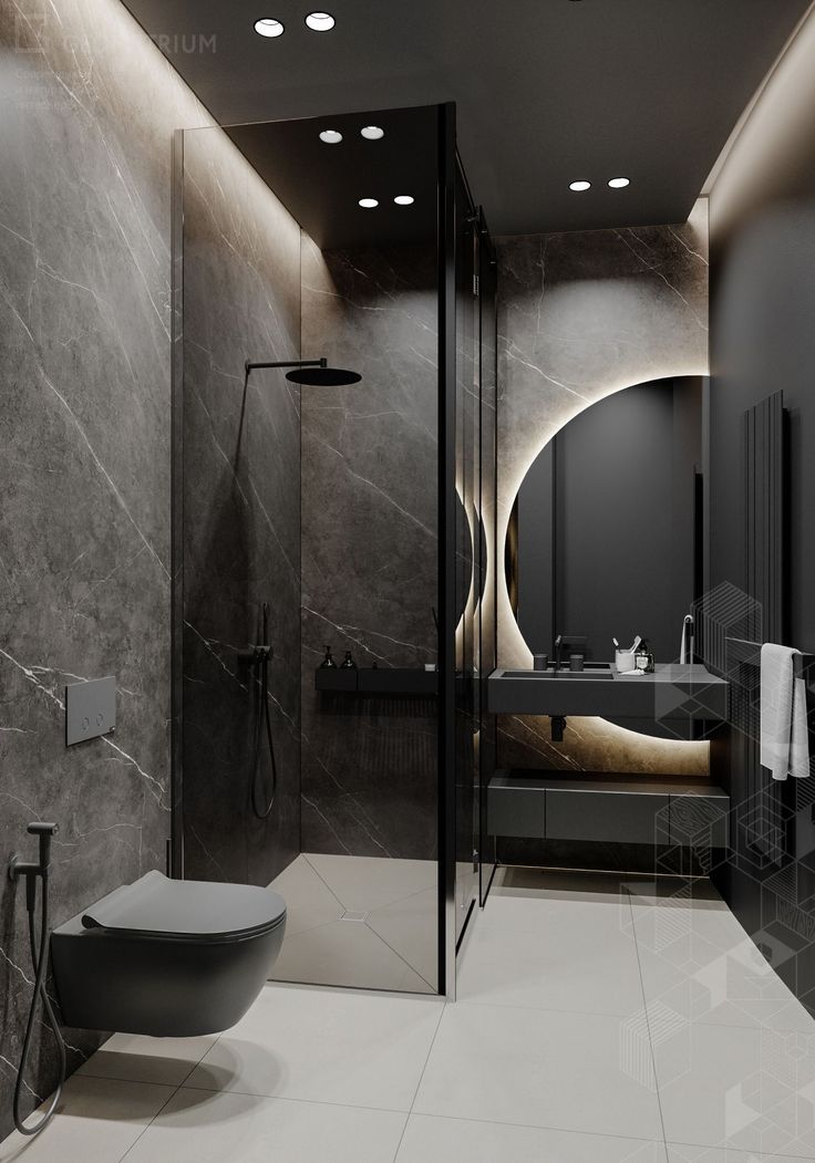 a modern bathroom with marble walls and flooring is pictured in this image, there are lights on the ceiling