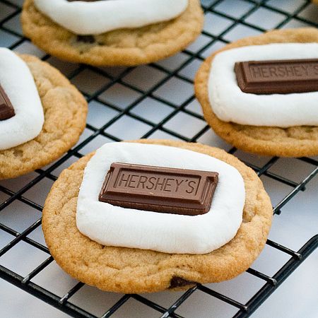 cookies with marshmallows and chocolate are on a cooling rack