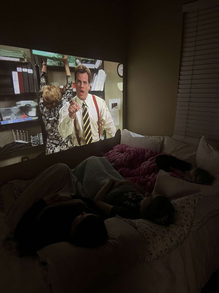 A group of friends watching a movie on a projector Bedroom With Movie Projector, Movie Night At Home Living Rooms, Room Projector Bedrooms Movie, Movie Night In Aesthetic, Watching Movies At Home Aesthetic, Movie Set Up At Home, Watching Movie Projector Aesthetic, Watching A Movie Aesthetic Tv, Watching Movies With Friends Aesthetic