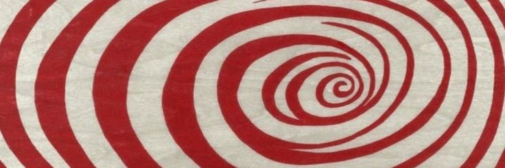 a red and white spiral design on a piece of paper