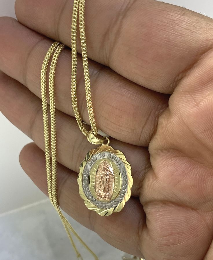 ● 10k Mother Mary Religious Solid Gold Medal Franco Necklace Chain Pendant Charm Virgin Mary Oval Shape Jewelry ●Metal Pendant : 10K Yellow Gold ●Purity : 10k with authenticity stamp ●Made in : United States ●Type : Virgin Mary Mother Mary ●Shape: Oval ●Necklace: Franco ●Length: 18"-20" ●Condition : Brand New ●Complimentary Premium Jewelry box included ●Free Shipping within U.S.A Be sure to hit "favorite" on the right so it remains on your favorites list and/ or add to your wishlist(s). BUY GENUINE GOLD JEWELRY WITH 100% CONFIDENCE  Please visit my shop below for my other quality items: https://www.etsy.com/shop/EmpireJewelryDesign Oval Rose Gold Diamond-cut Necklace, Yellow Gold Oval Figaro Chain Necklace, Yellow Gold Oval Necklace With Figaro Chain, Oval Yellow Gold Necklace With Figaro Chain, Gold Oval Necklace Fine Jewelry, Gold Oval Necklaces In Fine Jewelry Style, Gold Oval Fine Jewelry Necklace, Gold Oval Necklace In Fine Jewelry Style, Gold Oval Jewelry Stamped 14k