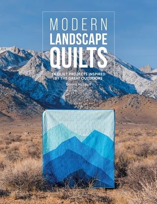 the cover of modern landscape quilts, featuring mountains in the background and blue sky