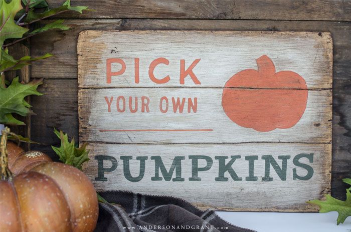 a wooden sign that says pick your own pumpkins