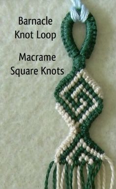 a green and white macrame knot hanging on a wall