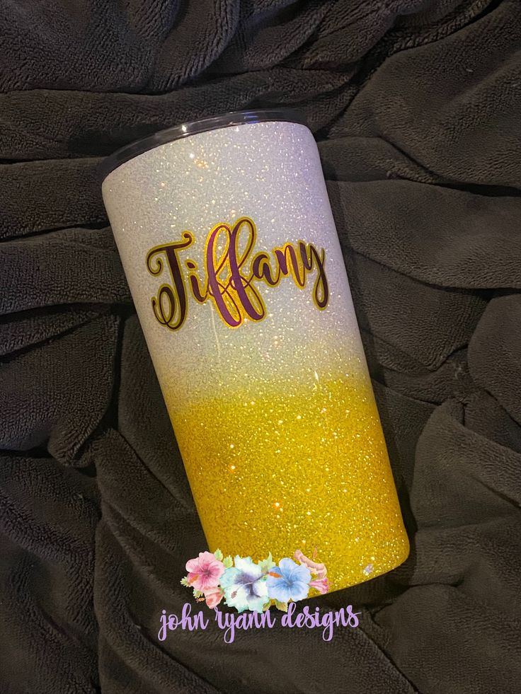 a yellow and white tumbler with the name tiffany on it