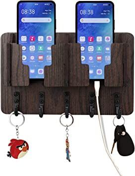 two cell phones are attached to hooks with key chains