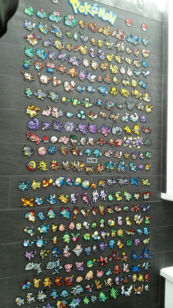 a large display of pokemon stickers on the wall in a room with tiled floors