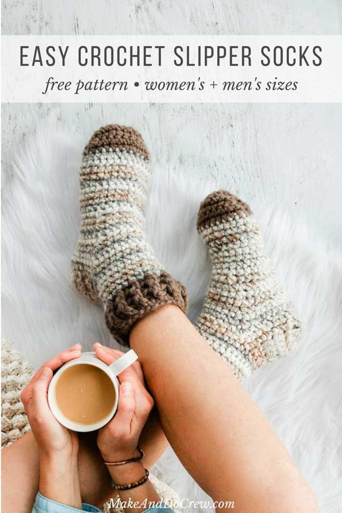 a woman is holding a cup of coffee while wearing crochet slipper socks