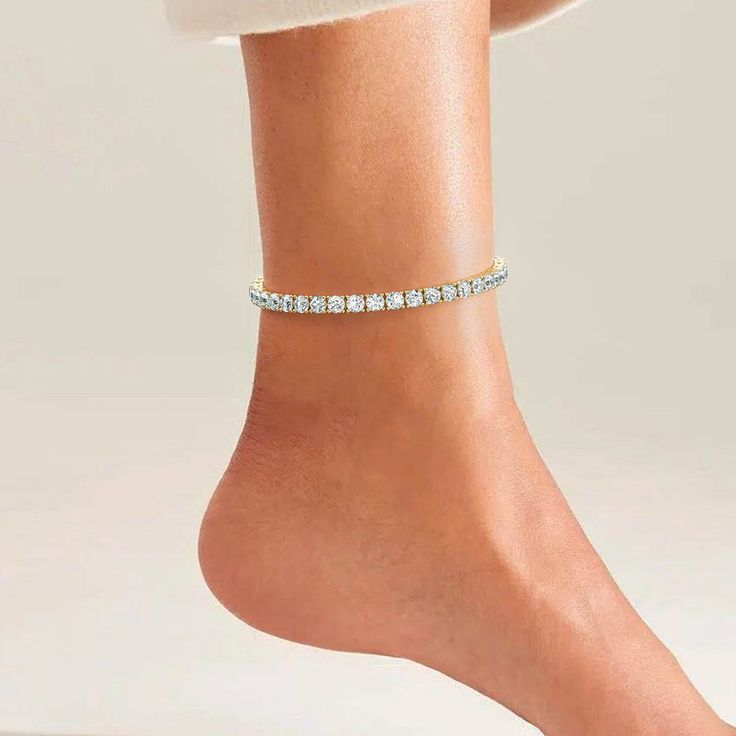 Oozing with cz diamonds, this Sparkling Tennis Anklet has a sophisticated & elegant design that is certain to draw attention. Made with crystal tennis chain design, durable clasp & set with sparkling cz diamonds. Now available in gold & silver. Definitely one of a kind piece that exudes endless energy & sparkly happiness. Tennis Anklet, Diamond Anklet, Tennis Chain, Nail Jewelry, Beautiful Handbags, Chain Design, Cz Diamond, Summer 2024, Jewelry Branding