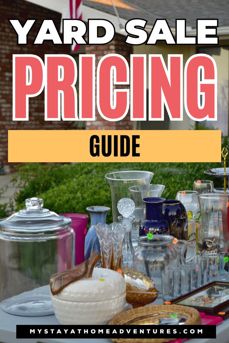 yard sale pricing guide with jars and glasses on the table in front of a house