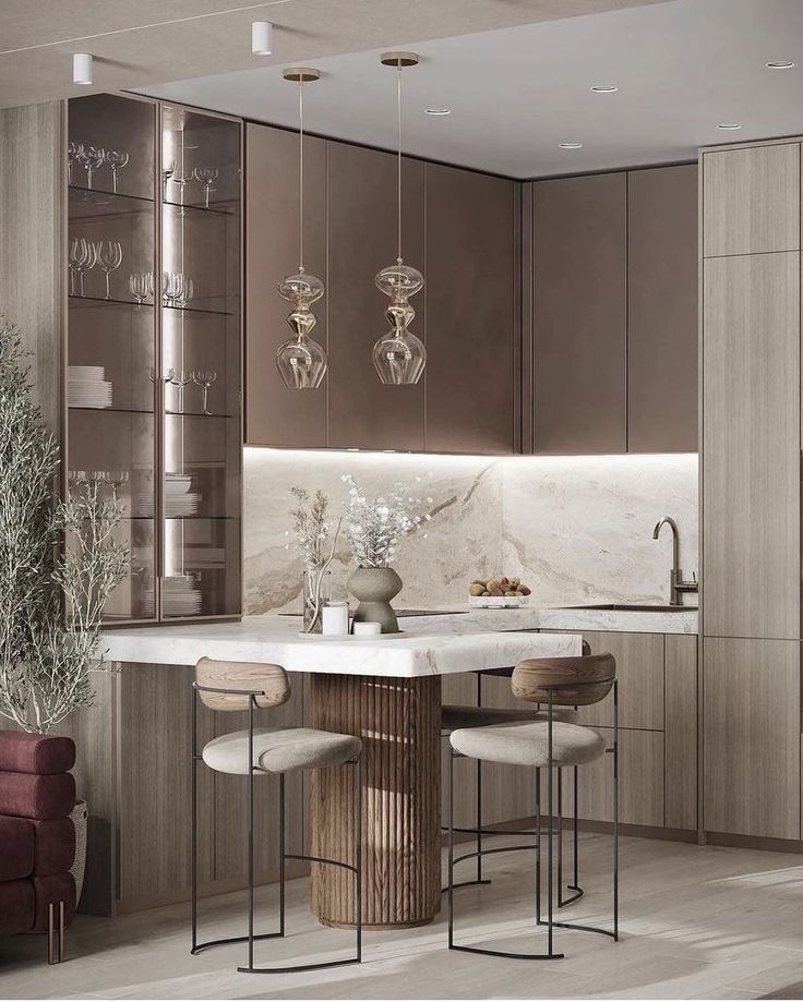 a kitchen with marble counter tops and stools