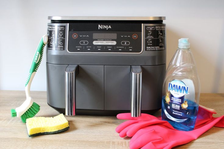 cleaning supplies are sitting on a table next to a washing machine