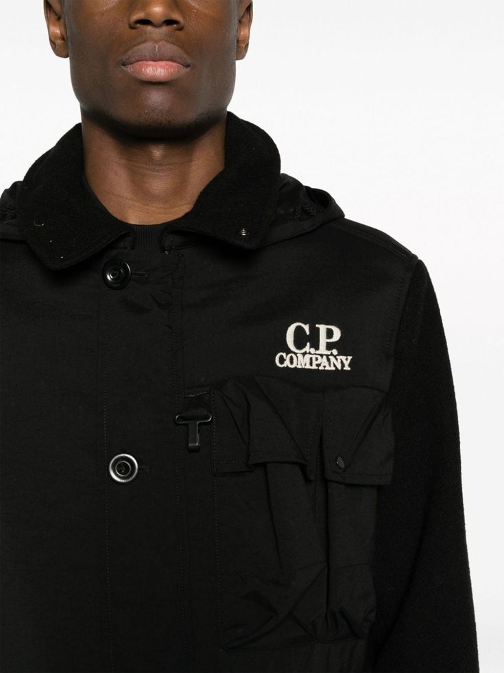 Duffel Mixed Goggle hooded jacket from C.P. Company featuring black, virgin wool, embroidered logo at the chest, classic collar, detachable hood, signature Goggles detail, front button and zip fastening, long sleeves, multiple cargo pockets and straight hem. C.P. Company suggests removing any detachable accessories before washing.. Size Info IT Color Detail Black Made In Albania Material outer fabric: 100% virgin wool, Lining: 100% polyamide/nylon, Secondary fabric: 100% Polyamide/Nylon Season O Collar Detachable, Coats Black, Trench Dress, 1017 Alyx 9sm, C P Company, Cape Coat, Detachable Hood, Cool Socks, Pant Shirt