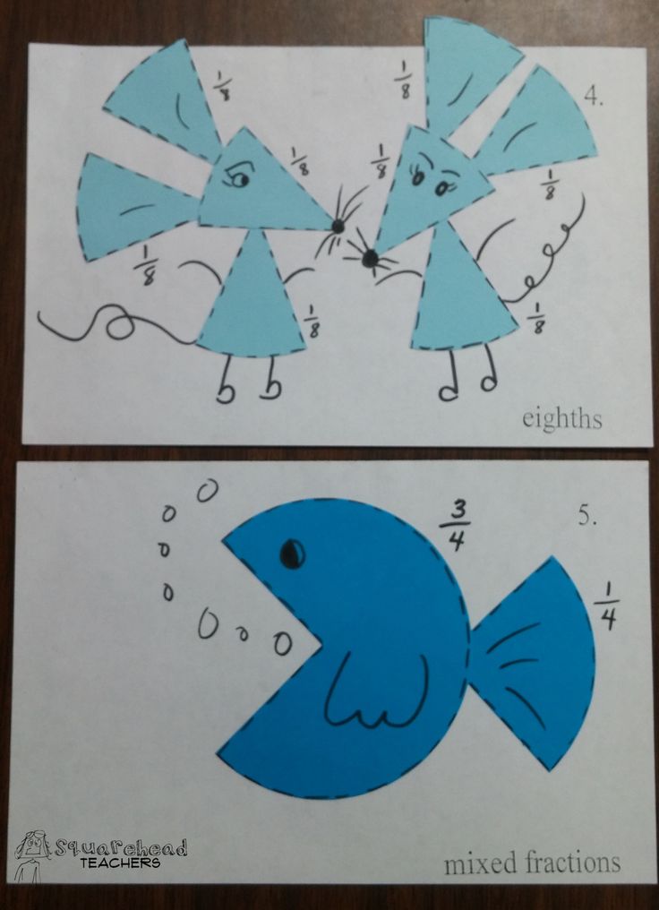 two blue fish cut out on paper with numbers in the shape of letters and numbers