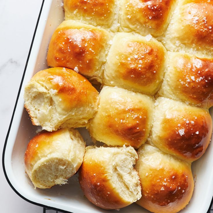 freshly baked hot cross buns in a baking dish