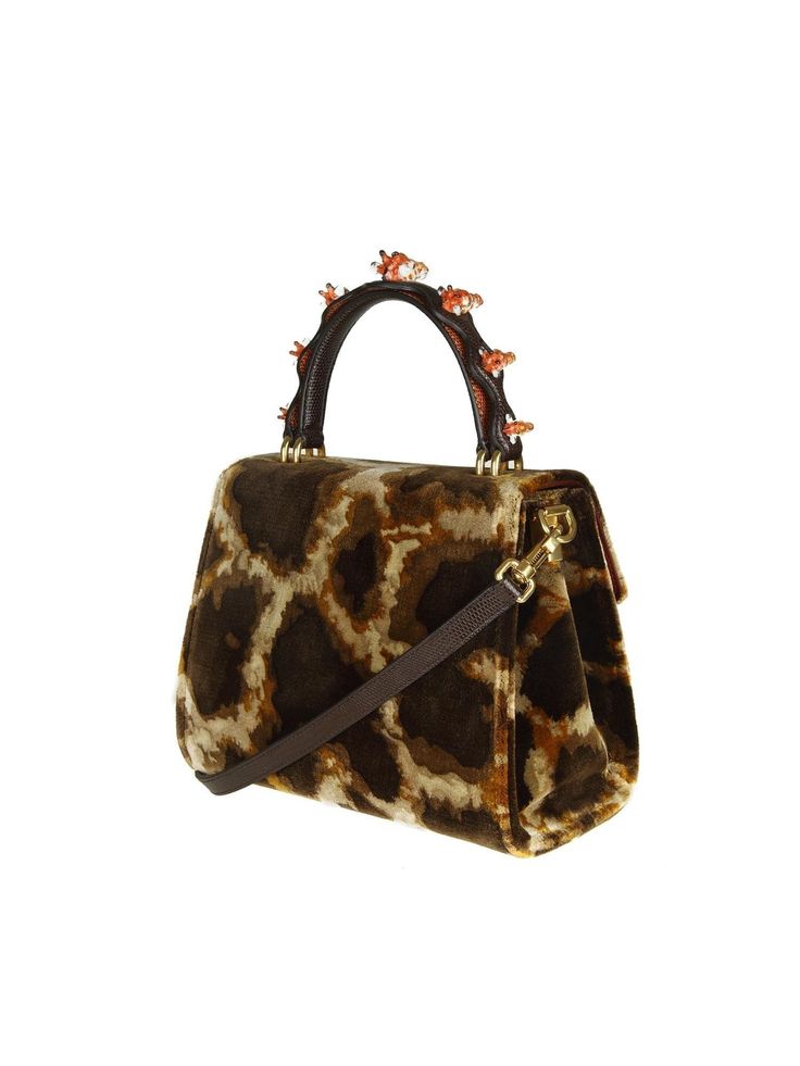 With a striking brown and gold giraffe print, this Dolce & Gabbana Giraffe-Print Welcome Tote Bag is the perfect way to add some exotic animal style luxe detailing your everyday look. Expertly crafted in Italy from soft leather, it features detachable adjustable strap for versatile wear options. Material: 64% Viscose 20% Leather 16% CottonRed inner liningAdjustable strapInside pocket zipper closureTwo compartmentsPush button flap closureLogo detailsMade ItalyMeasurements: 19cm x 25cm 12cmStrap: Giraffe Pattern, Leg Work, Welcome Bags, Giraffe Print, Print Trends, Animal Fashion, Exotic Pets, Retro Inspired, Card Wallet