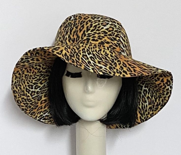 Wide Brim sun hat made with vintage cotton leopard fabric , lined in rayon print, the hat has a 2 section crown 3 1/2 " in length and a one piece 4" brim, a cotton band inside. One size fits most up to 23" Machine wash cold / hand dry Made in USA Press if needed / packable Fitted Sun Hat With Upf 50+ And Curved Brim, Fitted Wide Brim Sun Hat With Upf 50+, Fitted Sun Hat With Upf 50+ And Short Brim, Fitted Sun Hat With Upf 50+, Fitted Lined Hat For The Beach, Reversible Adjustable Brimmed Sun Hat, Adjustable Wide Brim Reversible Sun Hat, Adjustable Brimmed Lined Hat, Fitted Brimmed Sun Hat For Festivals