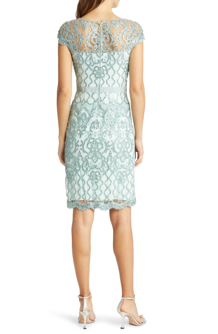 An elegant sheath exquisitely fashioned from ornate lace asparkle in tonal sequins is perfect for weddings, cocktail parties and date nights. 40" length (size 8) Hidden back-zip closure Bateau neck Cap sleeves Partially lined 60% polyester, 40% nylon with 60% cotton, 40% nylon contrast Dry clean Imported Special Occasion Elegant Lace Evening Dress For Spring, Spring Lace Evening Dress With Scalloped Lace, Elegant Spring Evening Dress With Lace Bodice, Elegant Spring Evening Dress With Scalloped Lace, Summer Lace Evening Dress For Formal Events, Summer Lace Evening Dress For Formal Occasions, Elegant Lace Evening Dress With Delicate Details, Fitted Bodice Knee-length Lace Dress, Summer Formal Lace Evening Dress