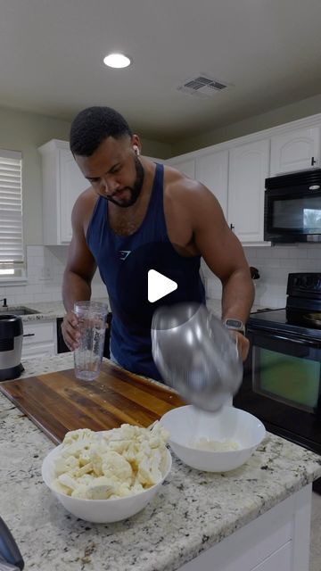 a man pouring something into a bowl on top of a counter