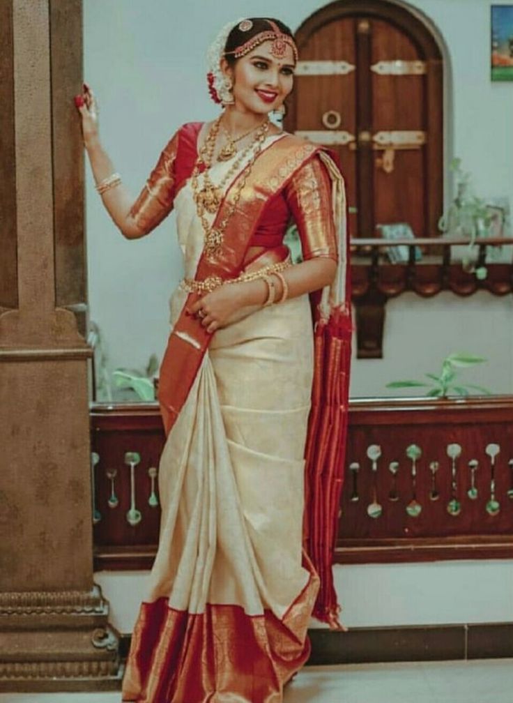 a woman in a sari posing for the camera