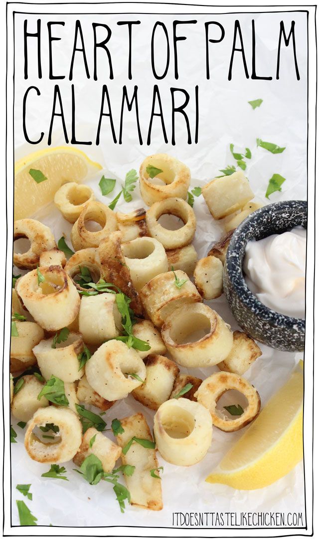 the heart of palm calamari is garnished with fresh herbs and lemon wedges