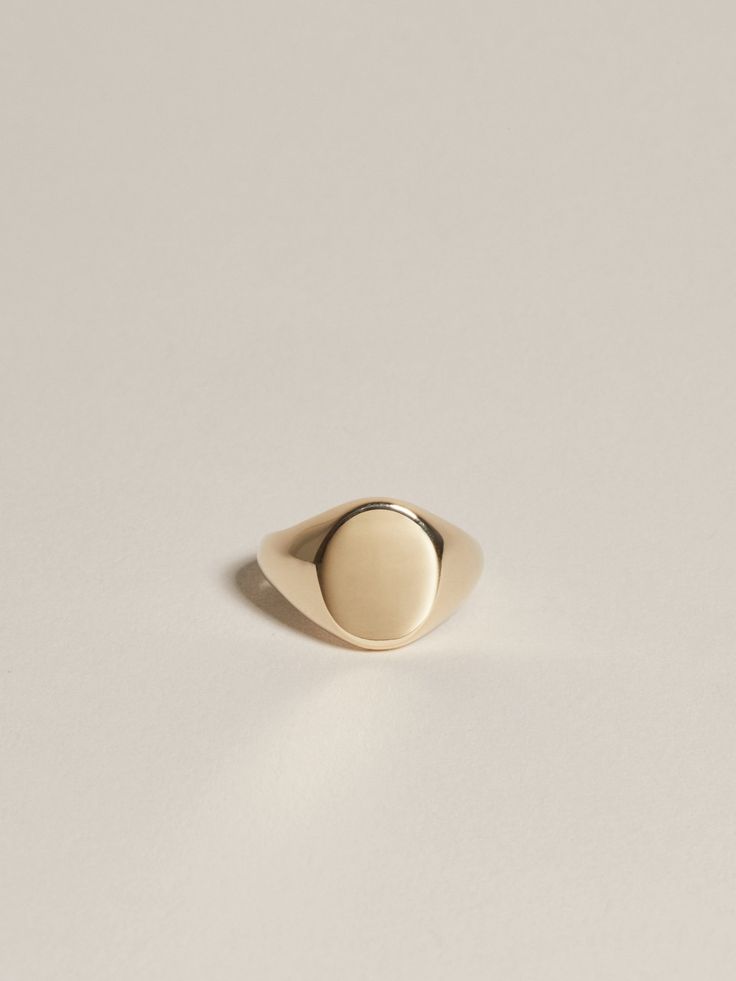 Signet Collection: Historically signet jewelry represented a physical marker of identity — used like a stamp to mark documents or add a seal of significance. These pieces are a modern reinterpretation of the idea in classic shapes engraved with a small unique detail. Solid 14k gold or sterling silver signet ring, measuring 10mm x 8mm at the face. Each ring is custom hand engraved by a master. Default font is "Allegro Script." Not quite sure of your ring size? To get the best fit see our recommen Elegant Gold Signet Ring For Everyday, Elegant Tarnish-resistant Signet Ring, Elegant 14k Gold Signet Ring, Elegant Everyday Hallmarked Signet Ring, Oval Fine Jewelry Signet Ring, Tarnish Resistant, Engraving Fonts, Silver Signet Ring, Pop Bottles, Recycled Gold