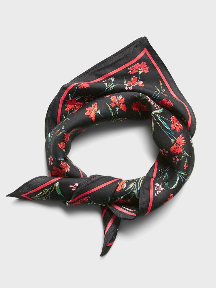 a black scarf with red flowers on it