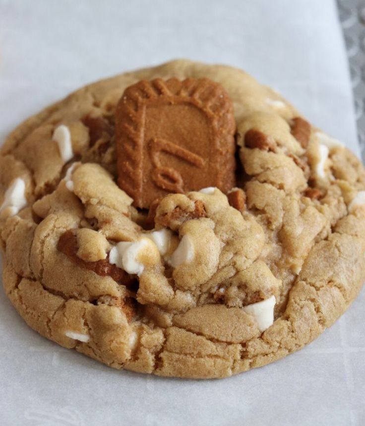 a close up of a cookie with white icing