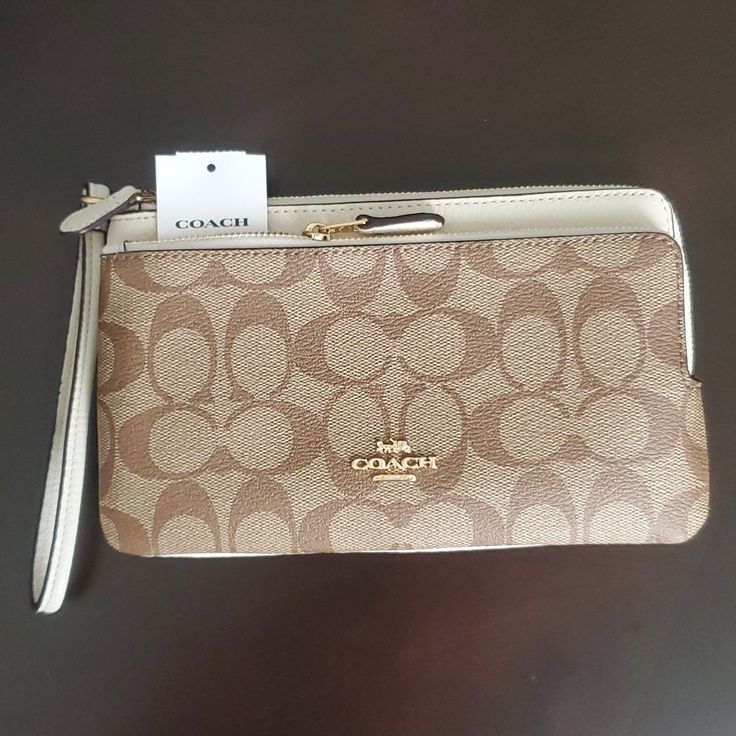 Brandnew. Never Worn Coach Large Corner Wristlet 2 Zip W 6 Slot Card Holder Pet & Smoke Free Home Excellent Condition Make Me An Offer Elegant Beige Bag With Wrist Strap, Elegant Beige Bags With Wrist Strap, Elegant Beige Clutch With Wrist Strap, Coach Beige Wristlet With Removable Pouch, Coach Beige Wristlet, Beige Coach Clutch, Beige Wristlet Clutch With Removable Pouch, Elegant Beige Coach Wristlet, Elegant Beige Wristlet For Travel