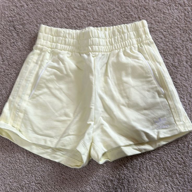 Adidas 3 Stripes Shorts, Lined Pockets With White Trim And White Logo On Left Thigh, Light Lemon Yellow In Color, High Rise With Elastic Waist Band,1.5” Inseam. Nwt Adidas Cotton Bottoms With Built-in Shorts, Sporty Adidas Bottoms For Spring, Sporty Adidas Spring Bottoms, Adidas Cotton Athleisure Bottoms, Adidas Cotton Shorts For Summer, Trendy Adidas Bottoms For Summer, Adidas Cotton Shorts For Spring, Adidas Sporty Short Bottoms, Sporty Adidas Short Bottoms