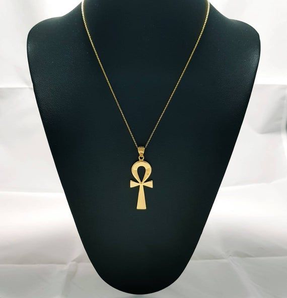 GET A FREE GIFT BOX WHEN YOUR ORDER OF 100$ OR MORE.PLEASE NOTE, ORDERS PROCESS TIME IS 3-5 DAYS.Ankh Necklace, 14k Goldfilled over Sterling Silver, Egyptian Revival Key Of Life, Ankh Jewelry.Handmade ankh Pendant features a stunning handcrafted ancient ankh symbol. The revival pendant is designed to help add a piece that assists you in harnessing the cultural power, create a change, and help adds to the capabilities of your imagination.The Egyptian ankh necklace carries a powerful message, lite Symbolic Gold Plated Necklaces With Large Pendant, Symbolic Gold Plated Necklace With Large Pendant, Ankh Pendant, Ceremonial 14k Gold Symbolic Necklace, Gold Cross Necklace For Ceremonial Occasion, Symbolic Yellow Gold Cross Necklace, Ceremonial Symbolic 14k Gold Necklace, Symbolic 14k Gold Ceremonial Necklace, Silver Ankh Necklace For Ceremonial Occasions