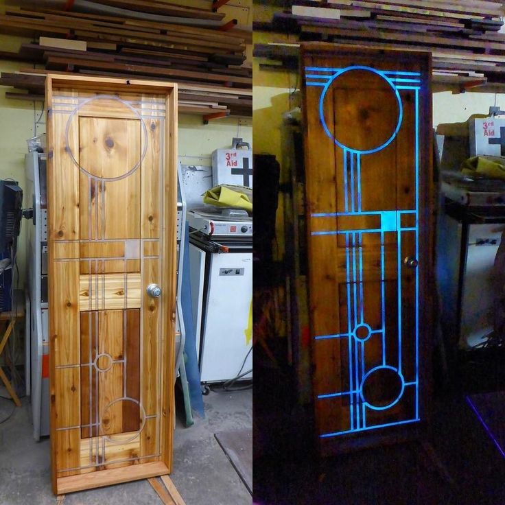 two tall wooden doors sitting next to each other in a room filled with wood furniture