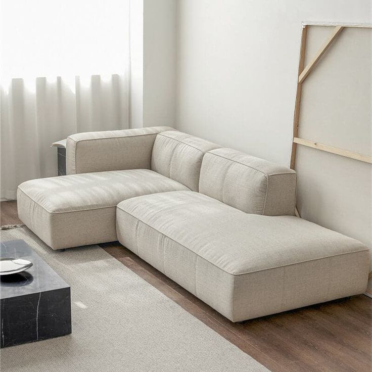 a living room with a large sectional couch