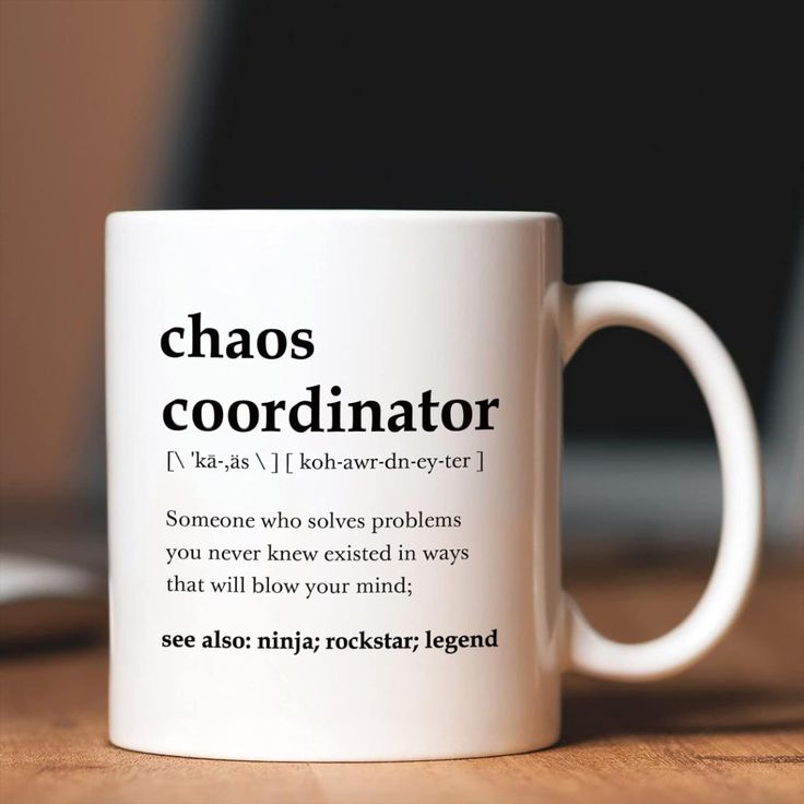 a white coffee mug with the words chaos coordator written in black on it