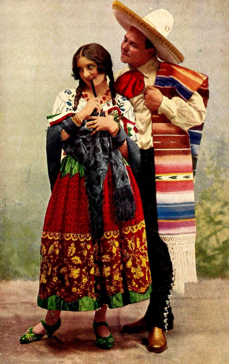 an old photo of a man and woman dressed in mexican attire, standing next to each other