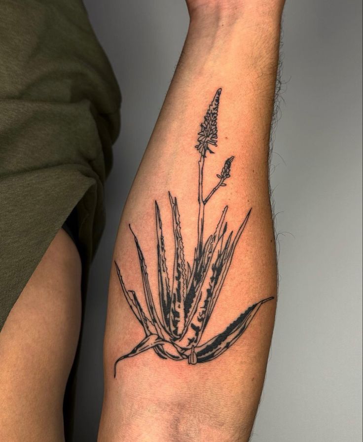 a tattoo on the arm of a person with a flower in it's center