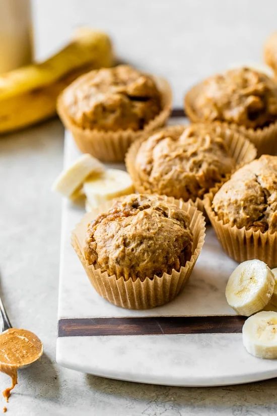 muffins on a plate with bananas and peanut butter