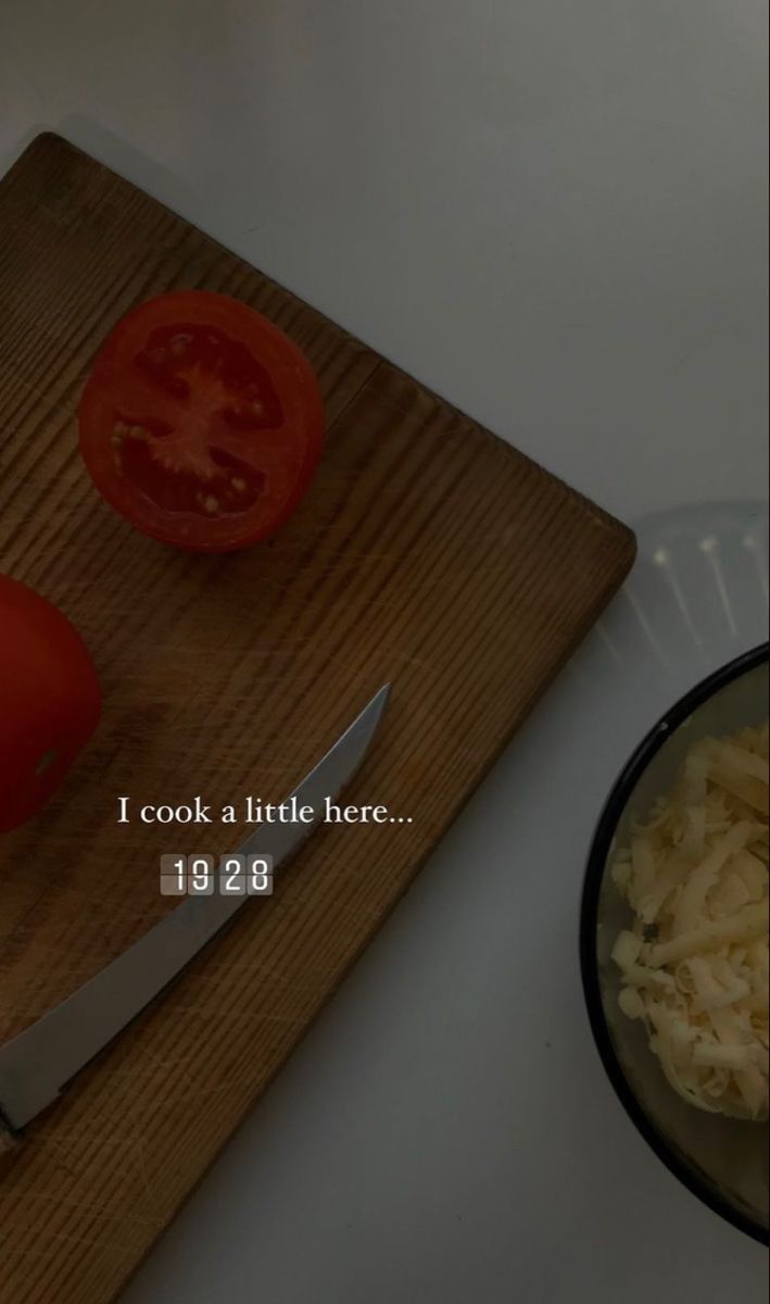 a cutting board with some food on top of it and a knife next to it