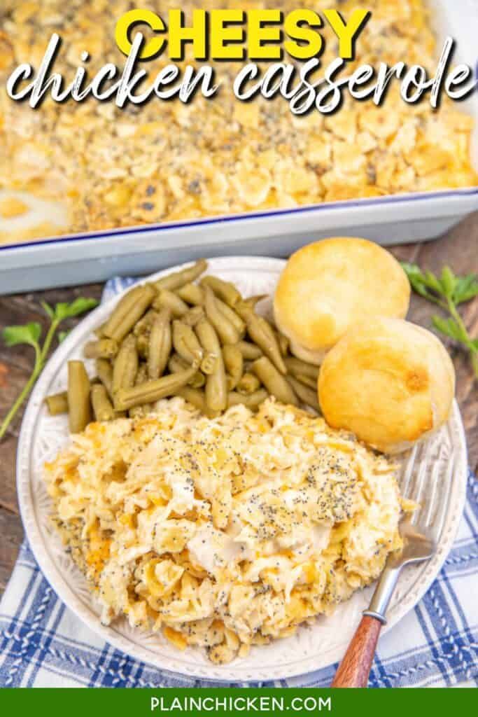 chicken casserole on a plate with green beans and biscuits