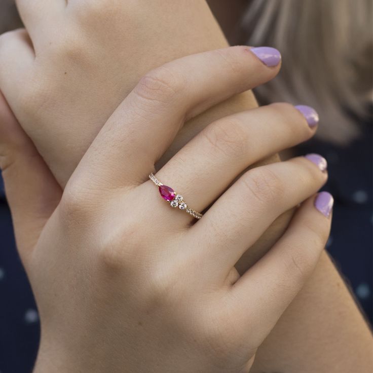 a woman's hand with a ring on it