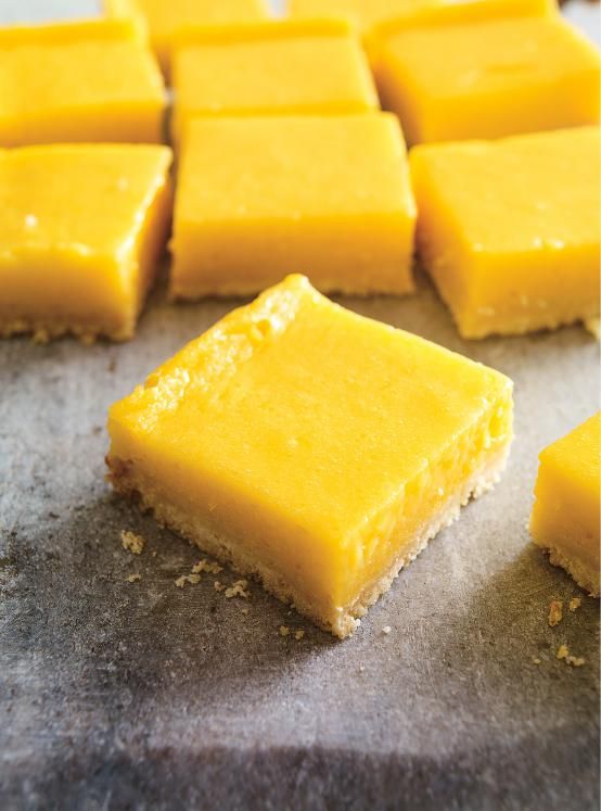 pieces of yellow cake sitting on top of a counter