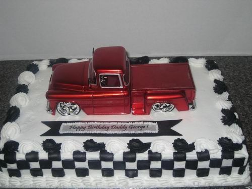 a birthday cake with a red truck on it