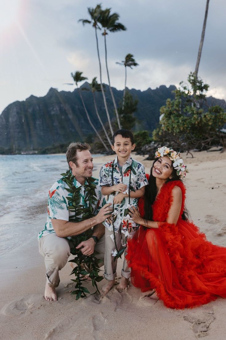 a family poses for a photo on the beach