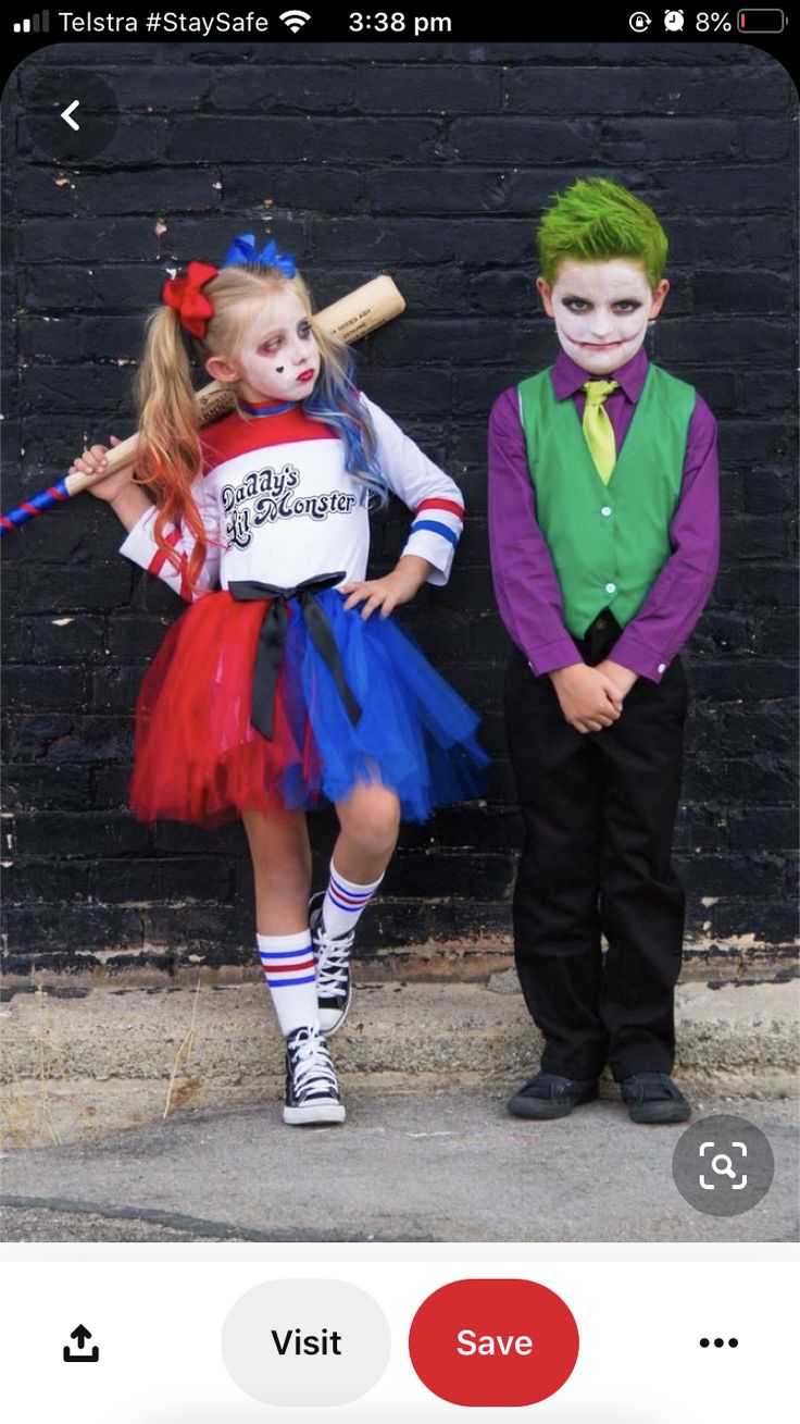 two children dressed up in costumes for halloween