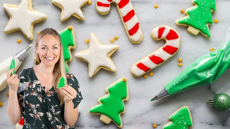 many decorated christmas cookies on a white plate