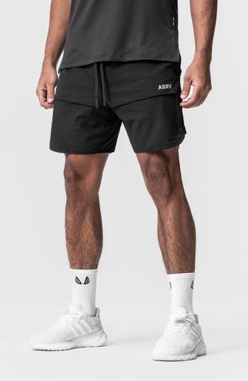 These water-resistant shorts are lightweight, linerless and made of four-way-stretch fabric for effortless movement. A technical front overlay panel partially conceals two vertical zip pockets to securely store your essentials while a handy utility loop holds a towel or shirt. 7" inseam; 22" leg opening; 13 front rise; 15" back rise (size Medium) Drawstring waist Utility loop holds shirt or towel Water resistant 76% nylon; 24% spandex Machine wash, line dry Imported Functional 4-way Stretch Shorts With Drawstring, Technical 4-way Stretch Black Bottoms, Outdoor Compressive 2-in-1 Bottoms, Compressive Outdoor Shorts, Compressive Short Bottoms For Outdoor, Moisture-wicking Nylon Techwear Bottoms, Techwear Sports Shorts With Built-in Shorts, Functional Black Nylon Bottoms, Black Functional Nylon Bottoms